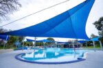 Large leisure pool at Werribee Outdoor Pool with shade sails and open recreation space.