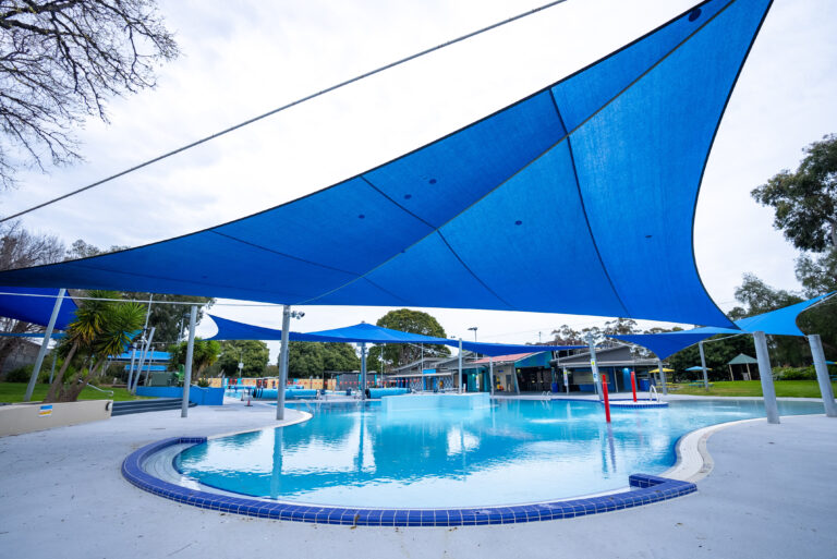 Large leisure pool at Werribee Outdoor Pool with shade sails and open recreation space.