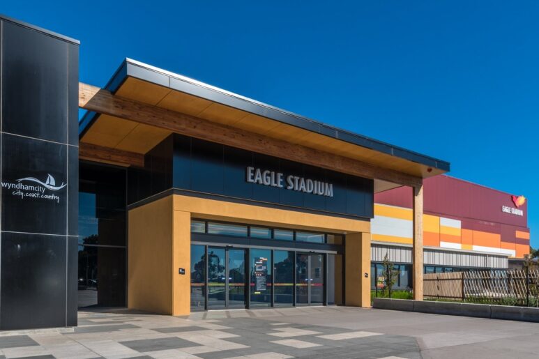 Entrance to Eagle Stadium with Wyndham City branding, glass doors, and modern architectural design.